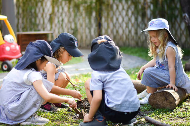 pupils playing with sticks