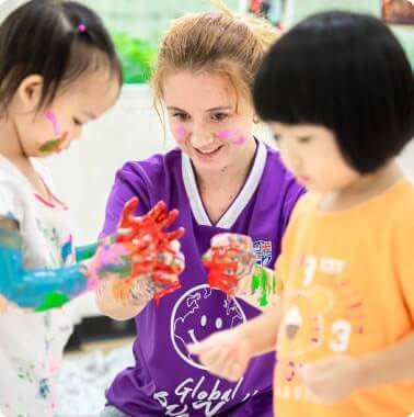 teacher playing with two girls
