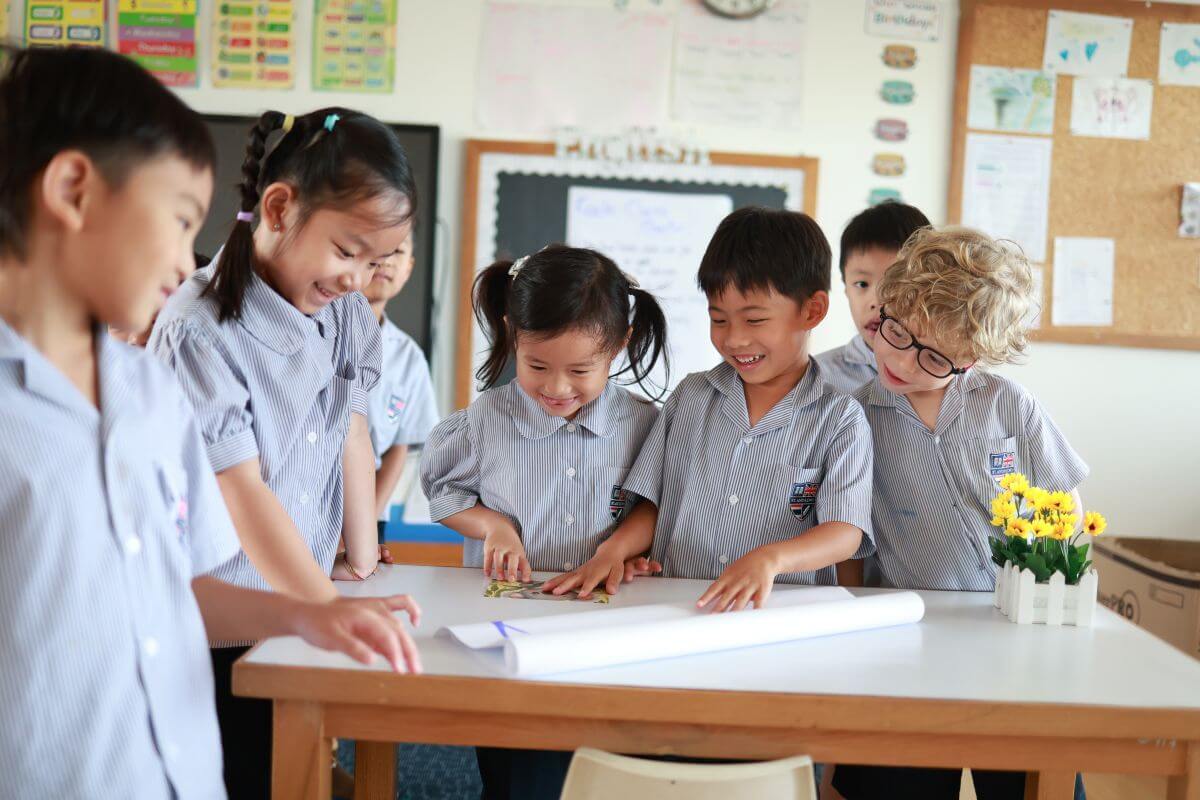 Primary at St Andrews Dusit Primary students working together on a classroom learning activity at St Andrews Dusit